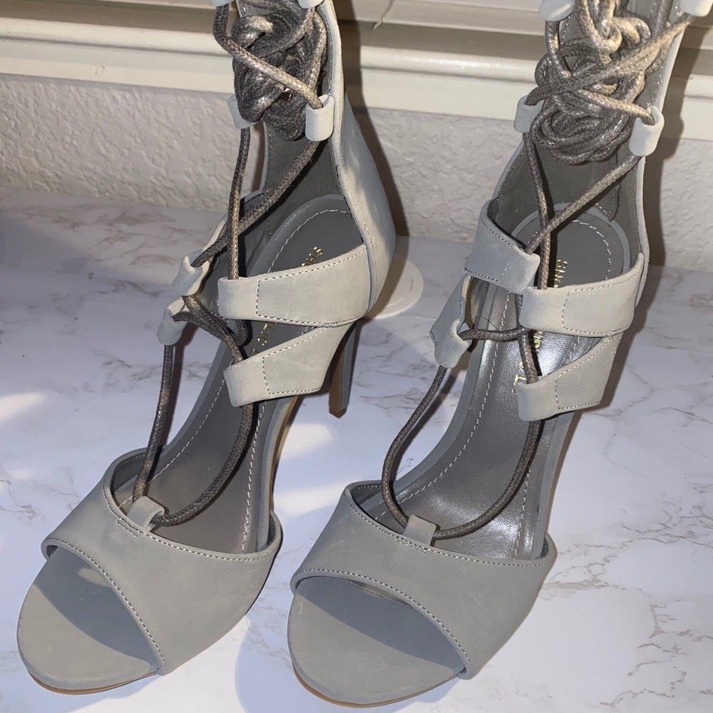 Grey laced up high heel shoes